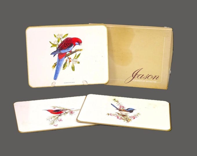 Six Birds of Oceania placemats with original box. Made in New Zealand by Jason. Acrylic with cork backs.
