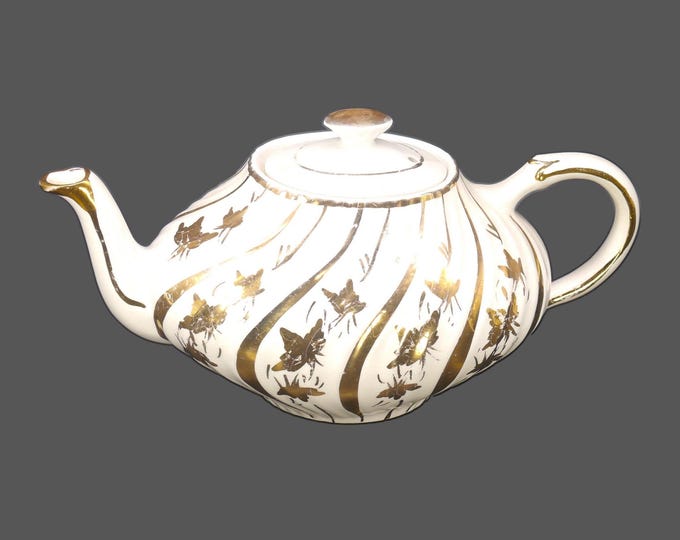 Arthur Wood 4833 four-cup, Aladdin-style teapot made in England. Gold swirls and leaves.