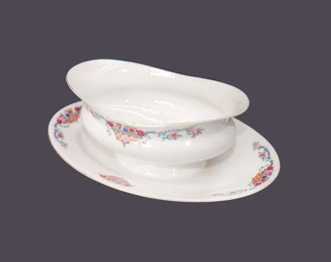 Victoria China 264 gravy boat with attached under-plate made in Czechoslovakia. Flowers in basket. Flaw (see below).