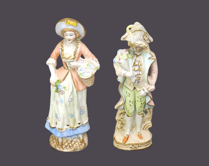 Pair of mid-century porcelain bisque figures. Man and woman in period dress. Made in Occupied Japan.