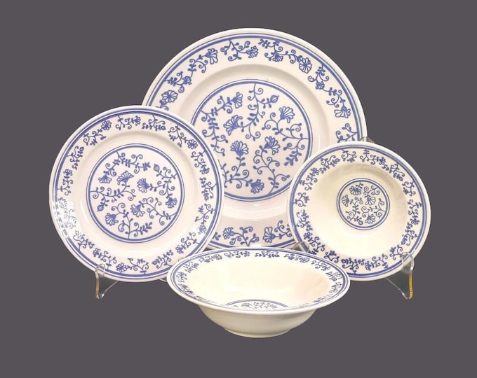 Homer Laughlin Sturbridge four-piece place setting. Blue-and-white tableware made in USA. Slight factory flaw (see below).