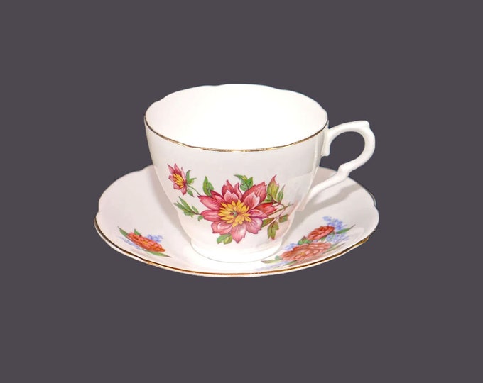 Genuine Bone China | Colclough tea set made in England. Pink camellias with yellow stamen and greenery.