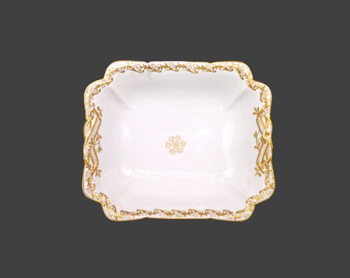 Antique Haviland Limoges serving bowl made in France. Gold center medallion, embossed gold. Imported Ovington Bros New York.