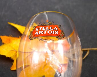 Stella Artois 50cl tall footed goblet | stemmed beer pint glass. Etched-glass branding, professional dispensing mark. Gold rim.