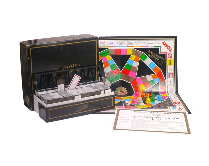 Acronym board game published in Canada 1985 by Tomy. Complete.