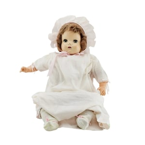 Antique composition baby doll original clothes. Porcelain bisque face, limbs and cloth body.
