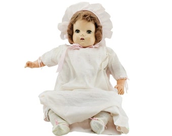Antique composition baby doll original clothes. Porcelain bisque face, limbs and cloth body.