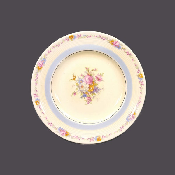Wood & Sons salad plate. Wood's Ivory Ware made in England. Central bouquet with roses, light blue verge. Sold individually.