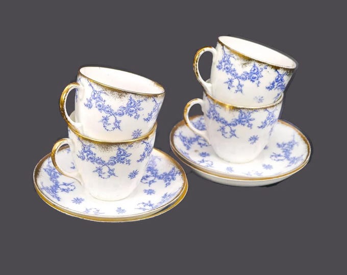 Four antique art-nouveau Regent Ibis bone china cup and saucer sets. Flow-blue tableware made in England. Flaw (see below).
