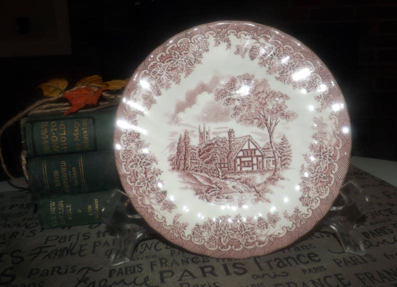 landscape scene. Red transferware bread-and-butter or side plate Vintage 1982 Tudor cottage Myott The Brook Pink