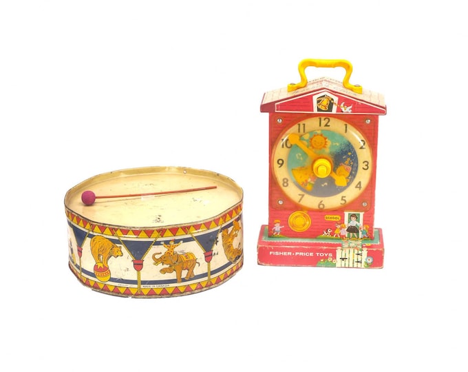Pair of vintage toddler toys. GSW metal drum with wooden drumstick, Fisher Price Music Box Teaching Clock #998.