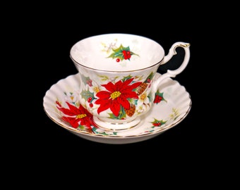 Royal Albert Poinsettia Christmas cup and saucer set. Bone china made in England.