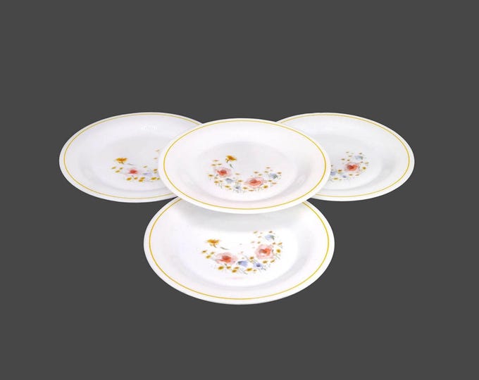 Four Arcopal ARP11 milk glass salad plates made in France.