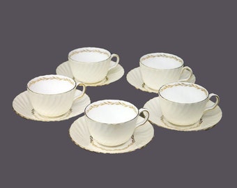 Five Minton S-520 Lady Devonish bone china cup and saucer sets made in England.