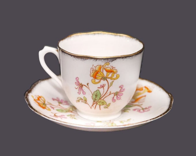 Almost antique Royal Albert Crown China Honeysuckles hand-decorated cup and saucer set made in England.