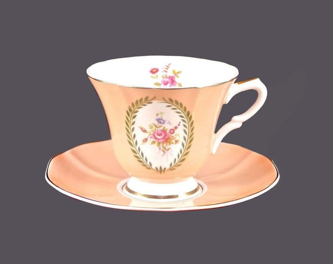 Susie Cooper cup and saucer set. Bone china made in England. Peach with florals.