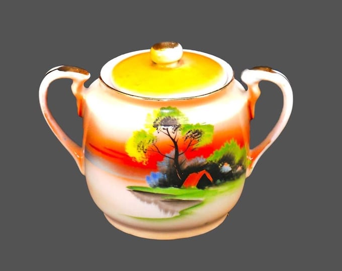 Chikaramachi hand-painted Nippon covered sugar bowl. Orange sky and cabin landscape. Small factory flaw (see below).