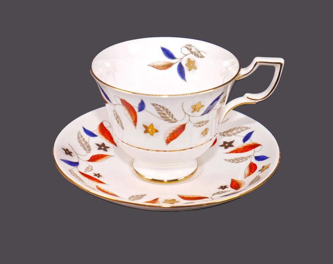Tuscan China D2489 bone china cup and saucer set made in England. Red, blue, gold leaves, gold star-shaped florals.