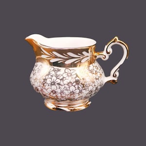Gibsons W989 hand-decorated, gold lusterware creamer jug made in England.