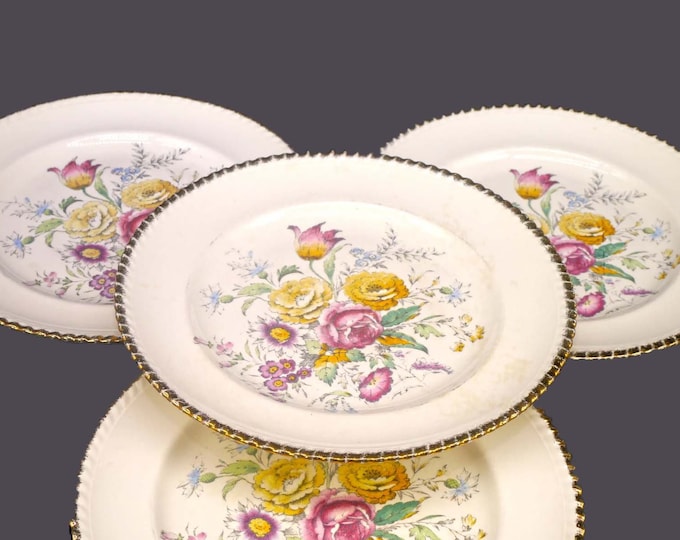 Four British Empire Ware Breath O' Spring dinner plates. Flaws (see below).