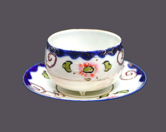 Art-deco era hand-painted Nippon moriage tea set (quad-footed cup with saucer). Cobalt, gold, maroon swirls, flowers.