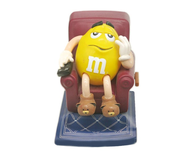 M&Ms Mr. Yellow candy dispenser. Mr Yellow in his Lazy Boy with the TV remote and bear slippers.