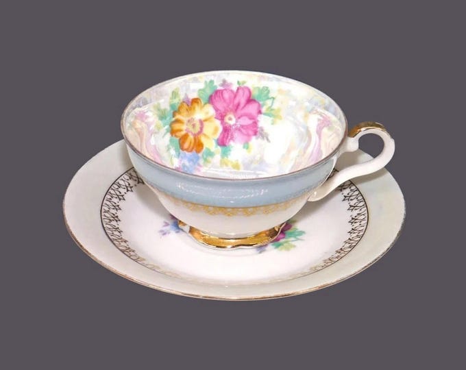 Hand-painted Nippon blue pearlized lusterware wide-mouth demitasse cup and saucer set.