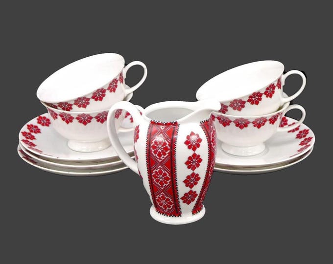 Rosenthal Classic Rose collection in traditional Ukranian motif. Four cup and saucer sets, one saucer, creamer jug. Made in Germany.