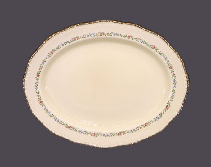 Ridgway 302 oval serving platter made in England. Pink roses, greenery with a gold rope edge.