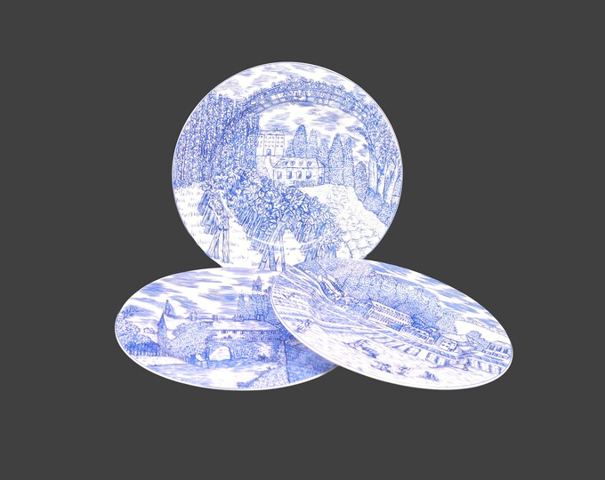Three American Atelier Blue Toile 5217 salad plates. Multi-motif blue-and-white landscape scene.