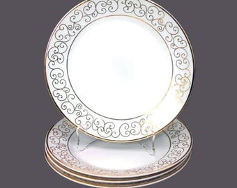 Four Holiday Joy Christmas salad or side plates.