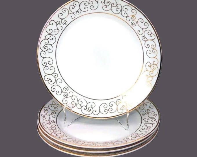 Four Holiday Joy Christmas salad or side plates.