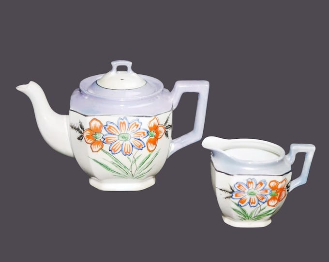 Hand-painted Nippon lilac lusterware four-cup teapot with creamer jug. Orange florals, lilac luster.