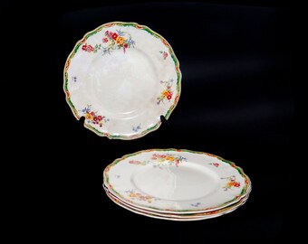 Four antique art-nouveau period Johnson Brothers Ilford dinner plates made in England.