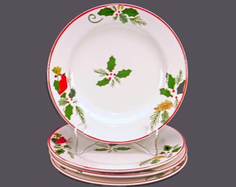 Four Pfaltzgraff Cardinal & Holly Christmas salad plates.