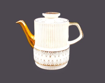 Gibsons W797 tall six-cup teapot made in England. Gold florals and scrolls. Flaw (see below).