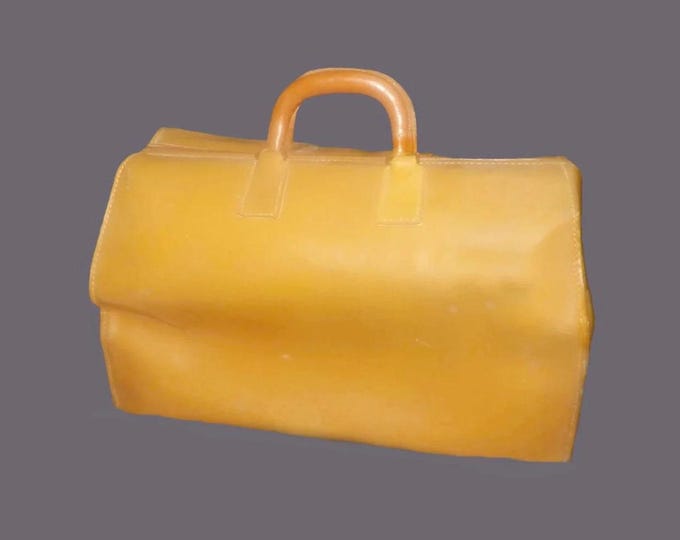 Caramel leather Gladstone-style doctor's bag. Canvas lined, zipper closing, leather handles, brass feet.
