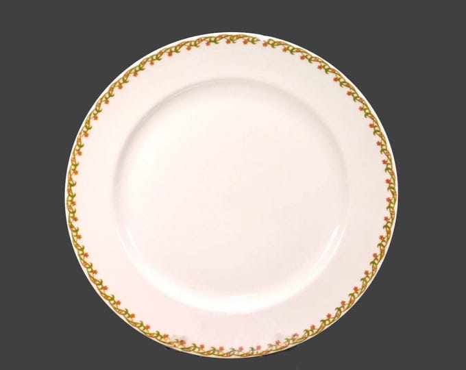 Antique art nouveau period Haviland Limoges luncheon plate. Peachy pink star-shaped floral garland. Made in France. Flaw (see below).