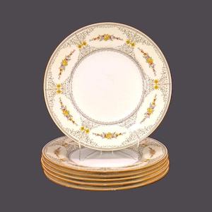Six antique numbered Minton Sheridan B1227 dinner plates made in England. Flaws.