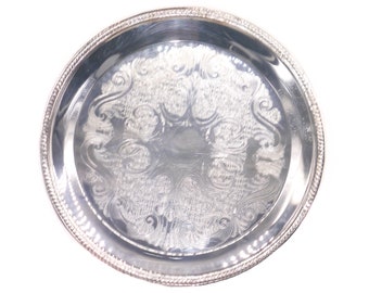 F.B. Rogers silver-plate on brass round tray. Made in USA.