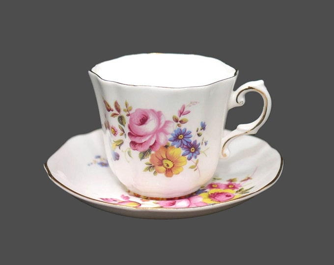 Royal Grafton 1517 bone china tea set made in England. Pink roses, sunflowers, blue daisies with gold trim.