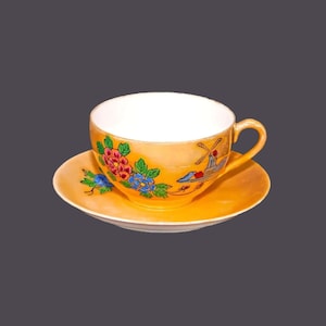 Occupied Japan | Nippon | hand-painted Nippon orange luster cup and saucer set. Windmill, florals.
