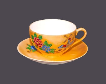 Occupied Japan | Nippon | hand-painted Nippon orange luster cup and saucer set. Windmill, florals.