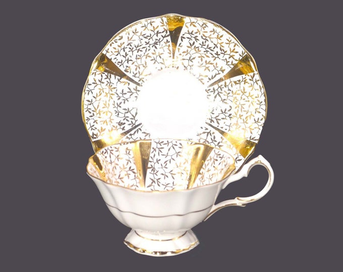 Queen Anne 5693 gold chintz bone china tea set made in England. Minor flaw (see below).