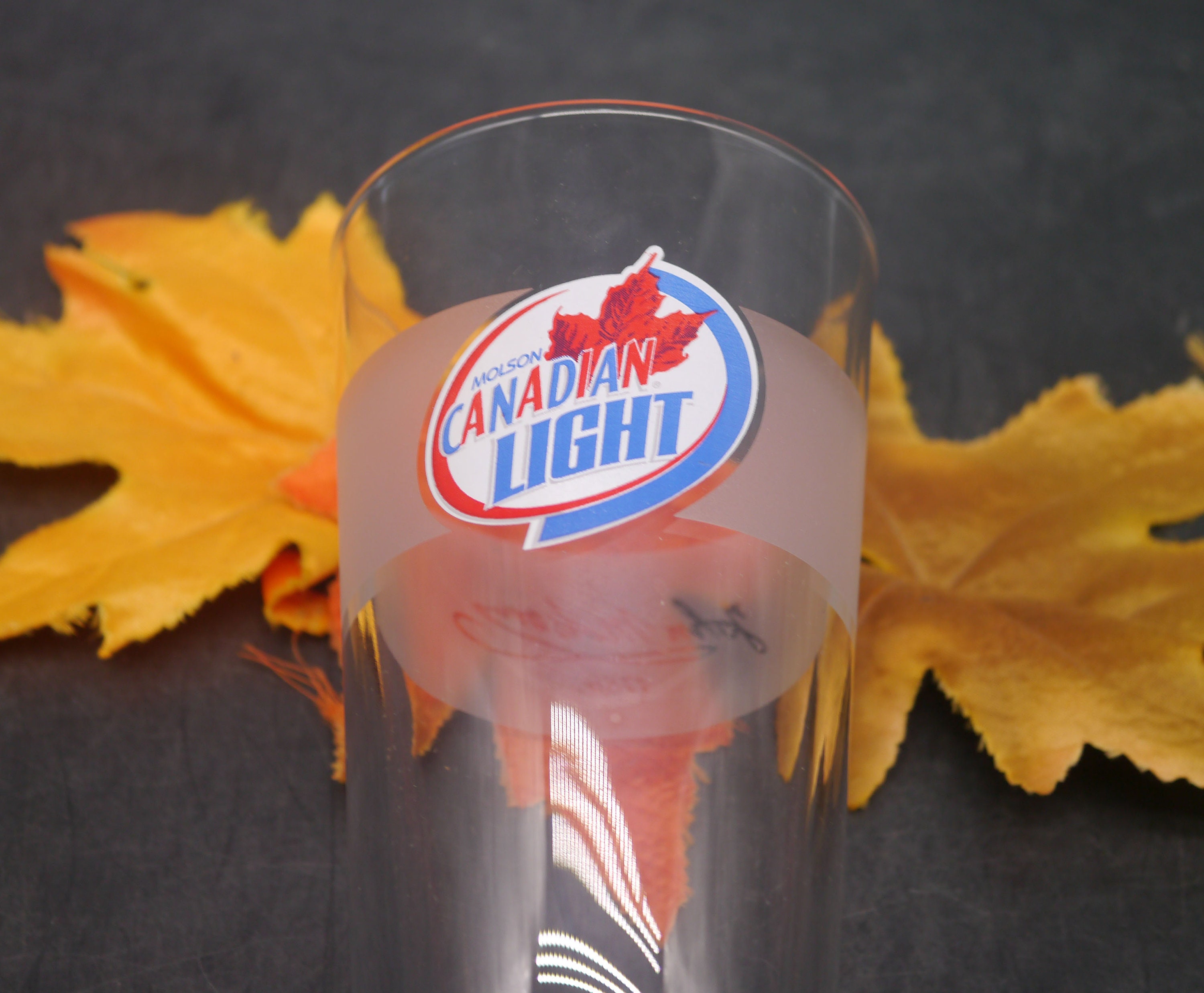 Molson Canadian Light pint glass. Etchedglass branding, frosted