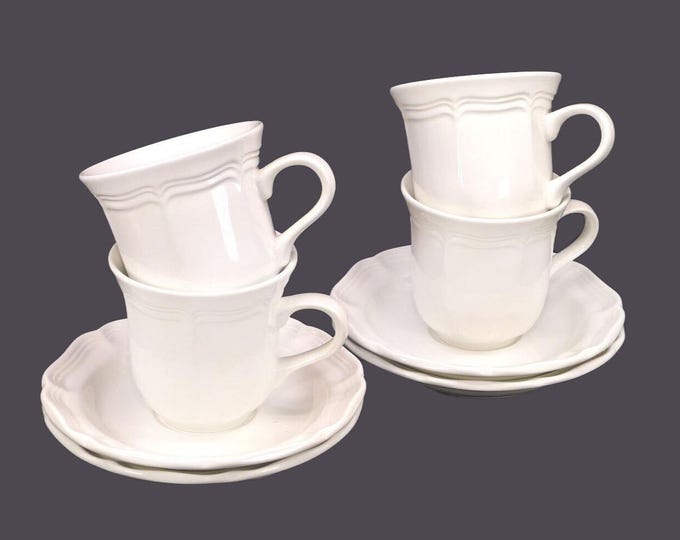 Four Mikasa French Countryside F9000 stoneware cup and saucer sets. Chef's favorite all-white tableware.