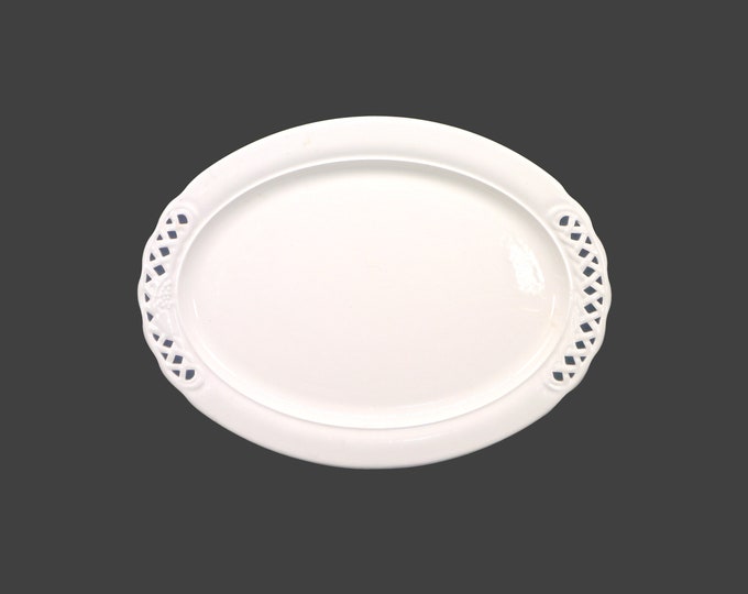 Pier 1 PER14 all-white oval turkey platter. Pierced edge, high-relief grapes. Made in Italy.