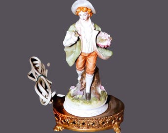 Lefton porcelain bisque figural table lamp. Young man Victorian dress, floral bouquet, brass base. Requires repair (see below).