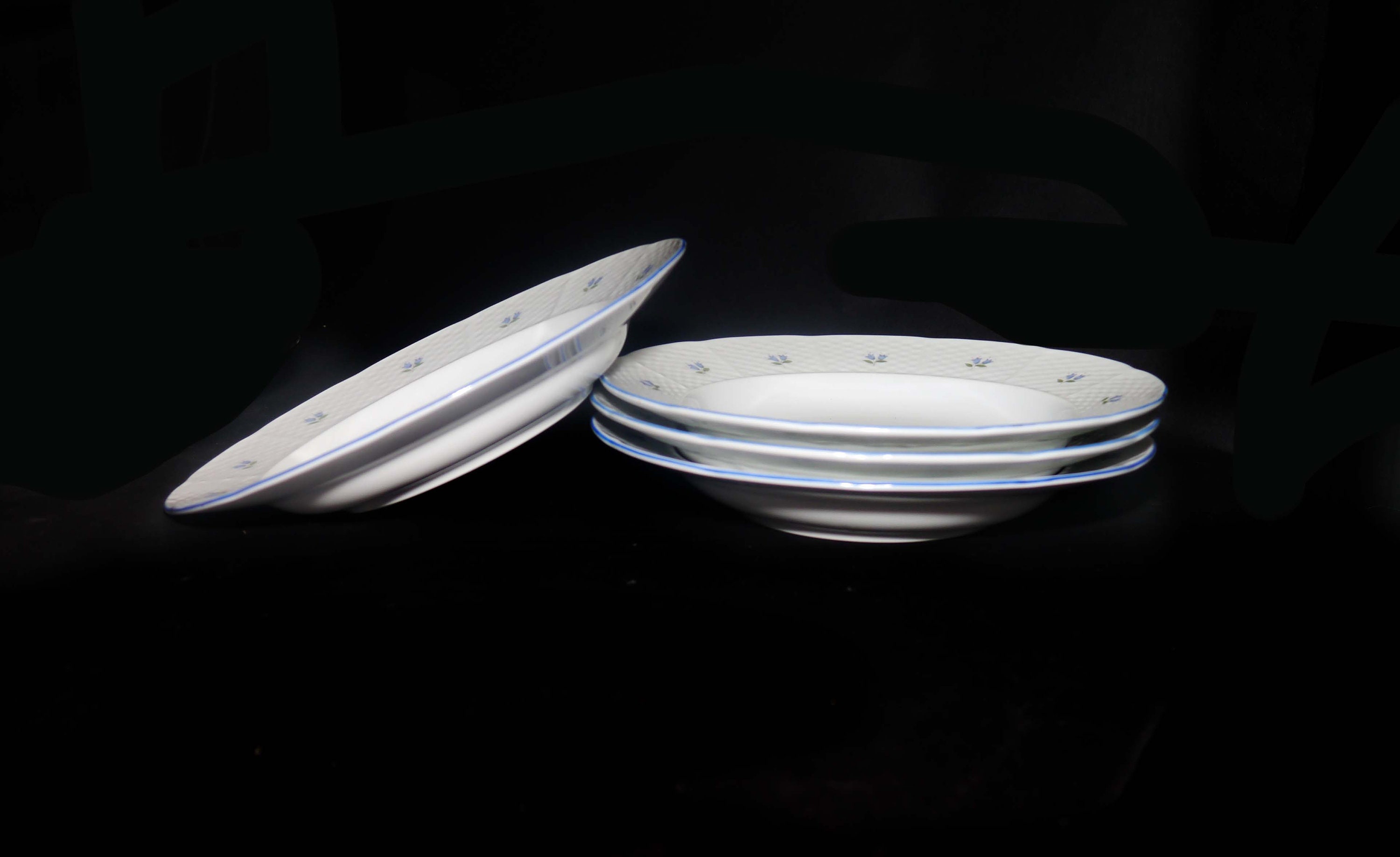 Four Belfor Blue Bell rimmed soup bowls made in Czechoslovakia for Birks.