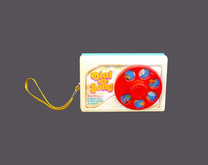 Walt Disney Dial a Song from 1963. Plays When You Wish Upon a Star. Working. Made in Hong Kong by LJN Toys.